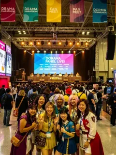 Attendees enjoying a bustling US dorama convention in 2026, featuring cosplayers and fan interactions.
