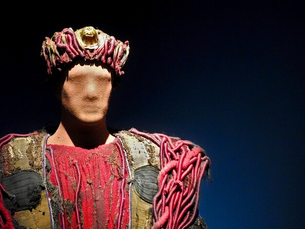 A close-up shot of a historical drama's production set, showing both intricate costume details and modern film equipment, illustrating the blend of historical elements with contemporary filmmaking techniques.