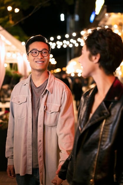 A K-drama actor confidently networking at an industry event in Los Angeles, engaging in conversation with a casting director and a producer. The scene is vibrant and professional, showcasing the importance of making connections.