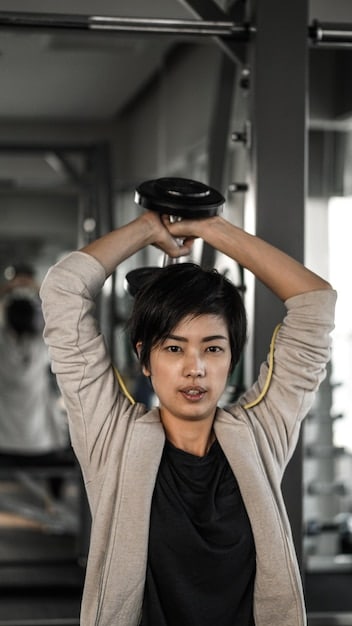 A split image featuring Jungkook from BTS in the gym lifting weights on one side, and him performing a dance routine on stage on the other. This visually shows his dedication to both strength and agility.