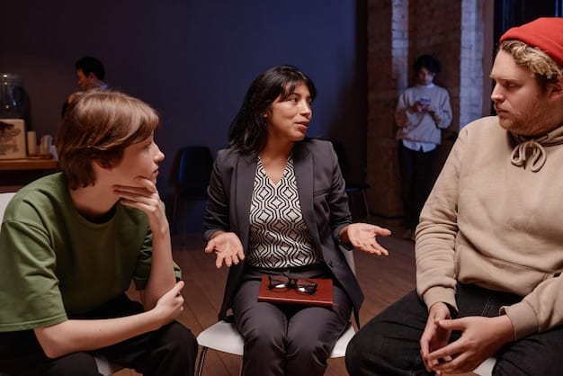 A candid shot of a K-Drama actor participating in a panel discussion about mental health awareness, with a visible audience in the background and a US flag subtly displayed. The actor is speaking into a microphone, appearing passionate and engaged.