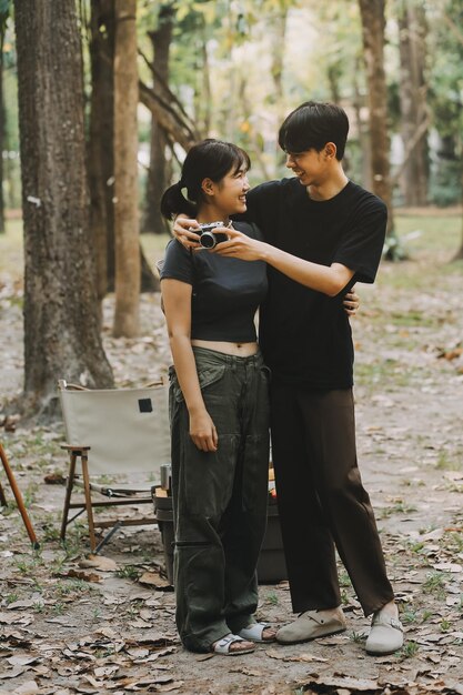 A split image showing K-Drama actors participating in different charitable activities. On one side, an actor is planting trees with volunteers, representing environmental conservation. On the other side, an actor is visiting a children's hospital, interacting with patients and staff, representing healthcare initiatives.