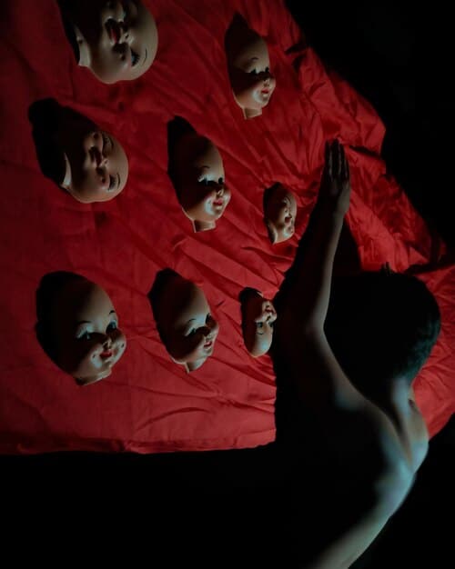 A close-up shot of a theater stage during a dramatic performance, with intense lighting and expressive actors. The scene captures a pivotal moment in the play, conveying deep emotion and tension.