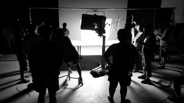 A behind-the-scenes shot of a popular drama series being filmed, showing the cast and crew in action.