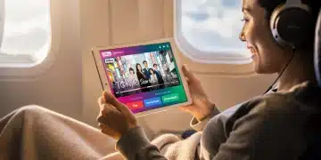 Person watching dorama offline on tablet, maximizing streaming app downloads